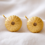gold shell stud earrings in 925 sterling silver on white background