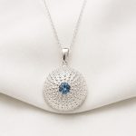 Handmade sterling silver sea urchin pendant featuring a aquamarine zirgon gemstone by Lilly's Papillon.