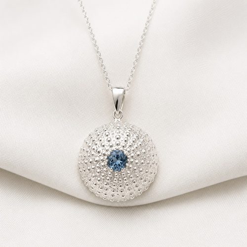 Handmade sterling silver sea urchin pendant featuring a aquamarine zirgon gemstone by Lilly's Papillon.