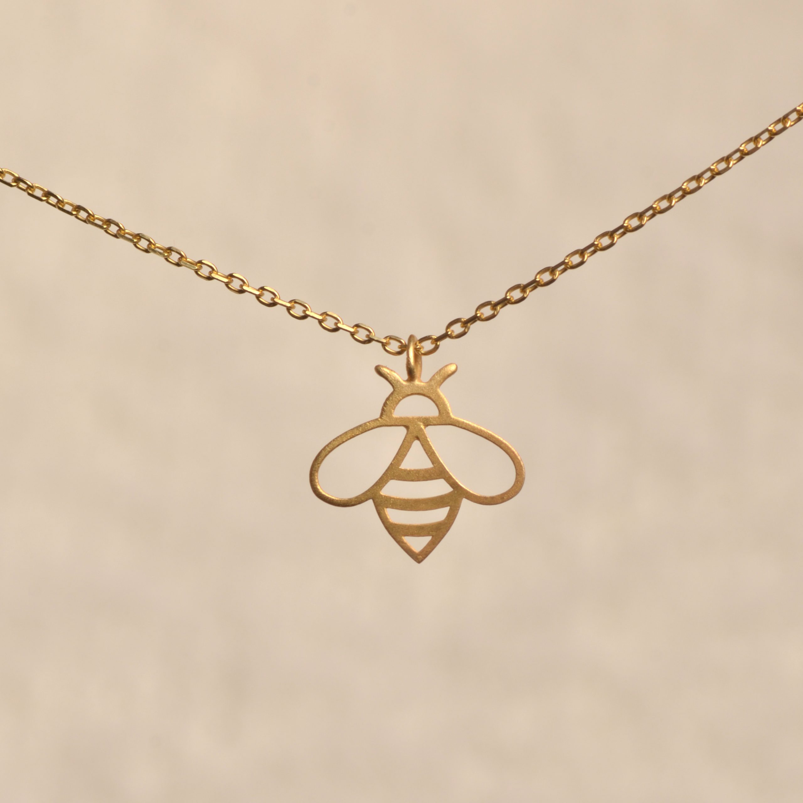 gold-vermeil-silver-bee-honey-necklace.jpg Gold vermeil 925 sterling silver bee necklace with delicate honey bee pendant.