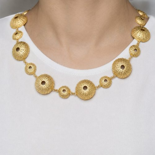 a handcrafted gold sea urchin statement necklace