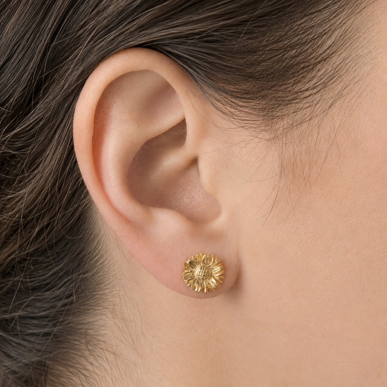 Gold-Sunflower-Stud-Earrings Gold sunflower stud earrings with floral design