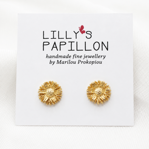 Gold sunflower stud earrings with floral design