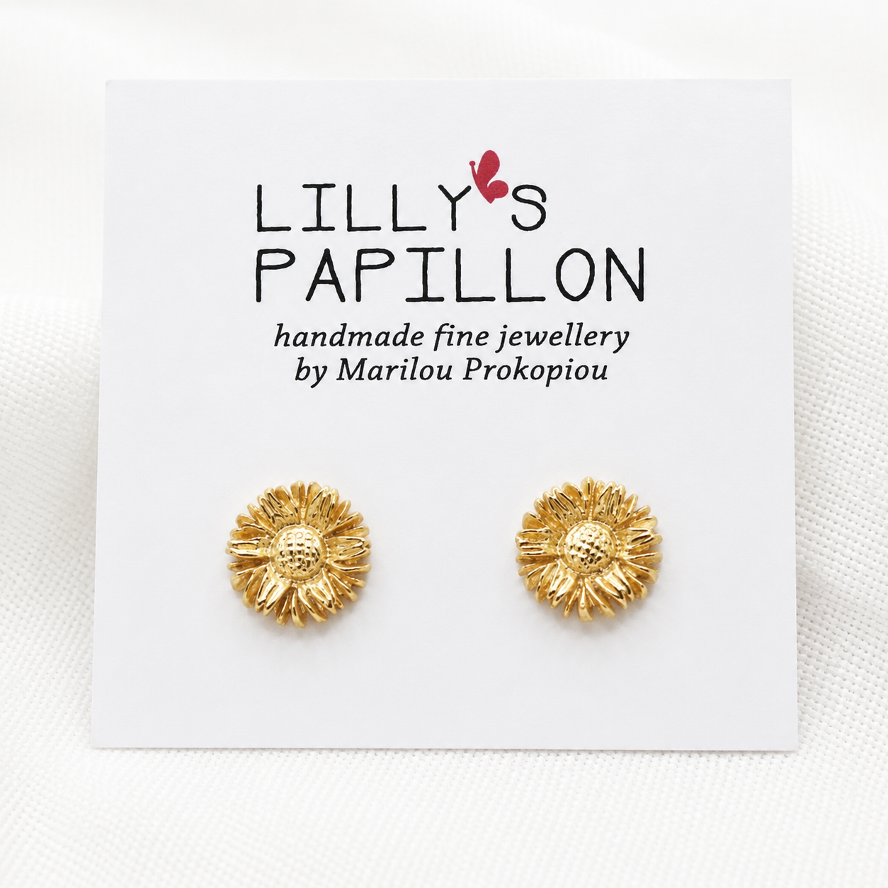 Gold-Sunflower-Stud-Earrings Gold sunflower stud earrings with floral design