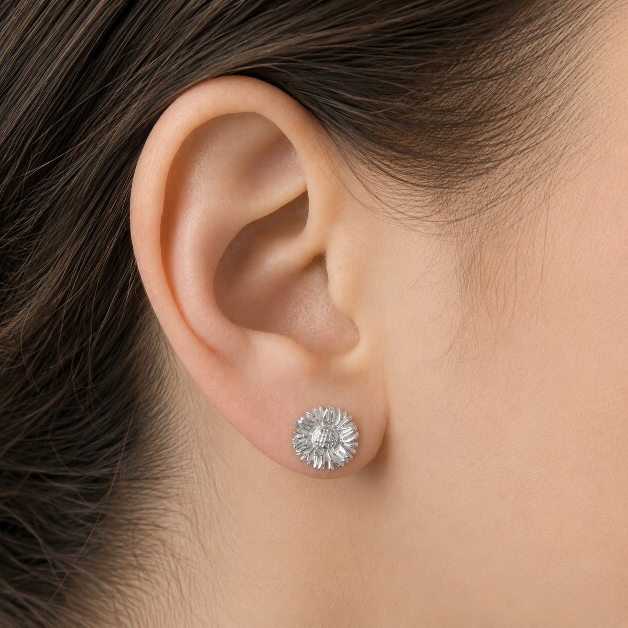 Silver-Sunflower-Stud-Earrings Silver sunflower stud earrings with floral design