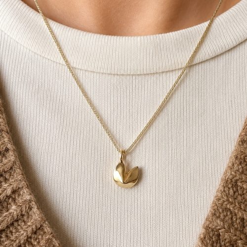 Gold fortune cookie pendant necklace on delicate gold cord