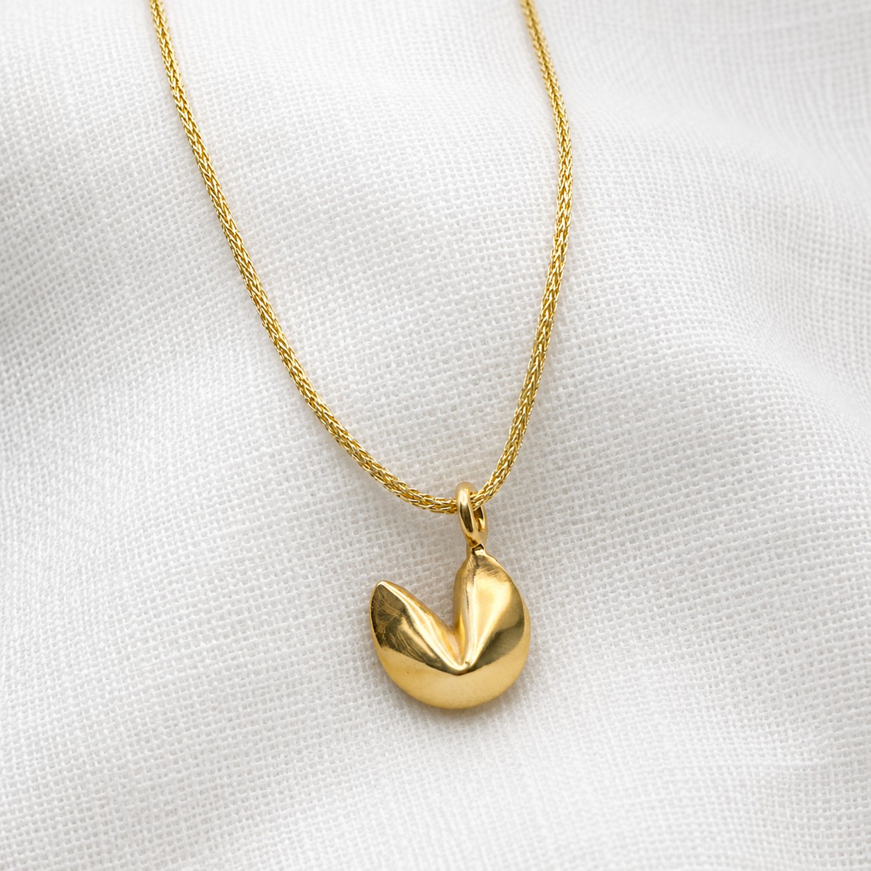gold-fortune-cookie-necklace Gold fortune cookie pendant necklace on delicate gold cord