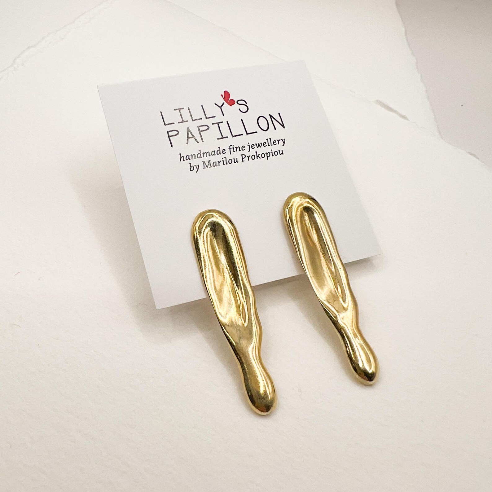 Minimal-gold-statement-earrings Sculptural gold statement earrings