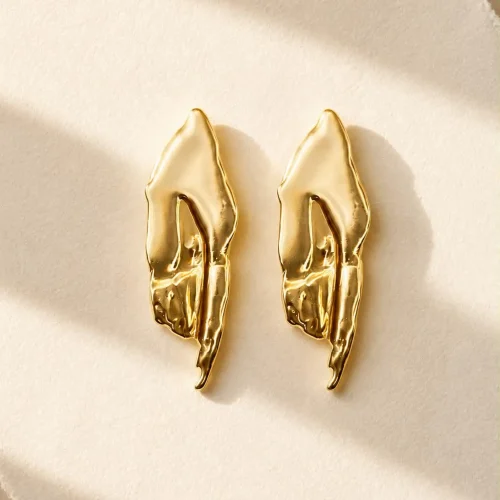 Gold organic statement stud earrings with sculptural abstract design