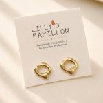 Gold organic sculptural stud earrings with an abstract open design