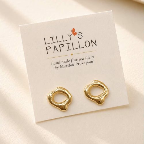 Gold organic sculptural stud earrings with an abstract open design