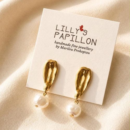 Gold pearl statement earrings with sculptural organic studs