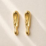 Sculptural gold statement earrings