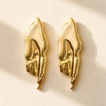 Gold organic statement stud earrings with sculptural abstract design