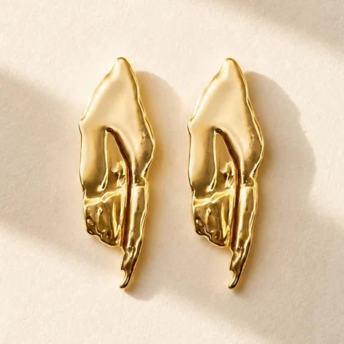 Gold organic statement stud earrings with sculptural abstract design