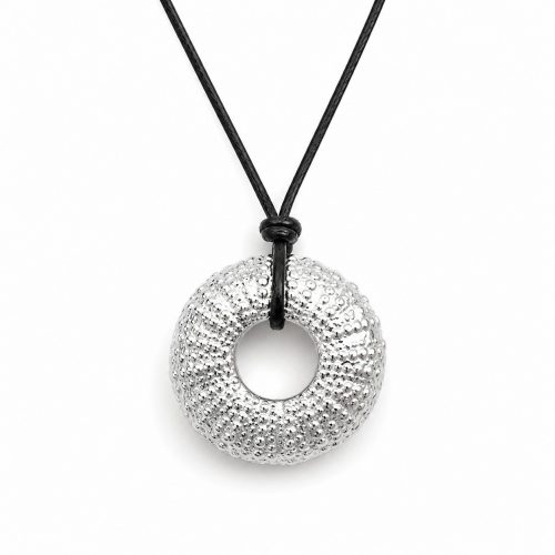 Handmade silver sea urchin pendant necklace on black cord inspired by Mediterranean marine life.